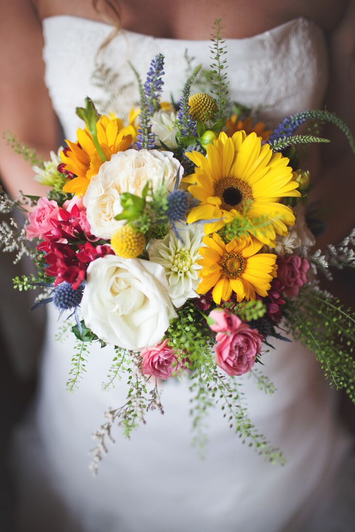 Marisa had a colorful, wildflower-inspired bouquet with daisies, garden roses and loose thistles and greenery to create a loose, hand-tied look. The bouquet was wrapped in burlap and lace from the hat Marisa's mother wore at her own wedding.