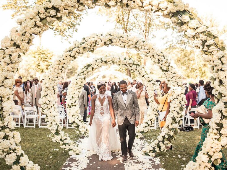 Infinity fairytale-themed wedding arch with white roses
