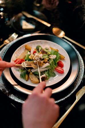 Wedding Guest Eating Salad at Reception