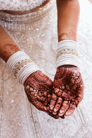 Hands With Henna and White Wedding Bangles
