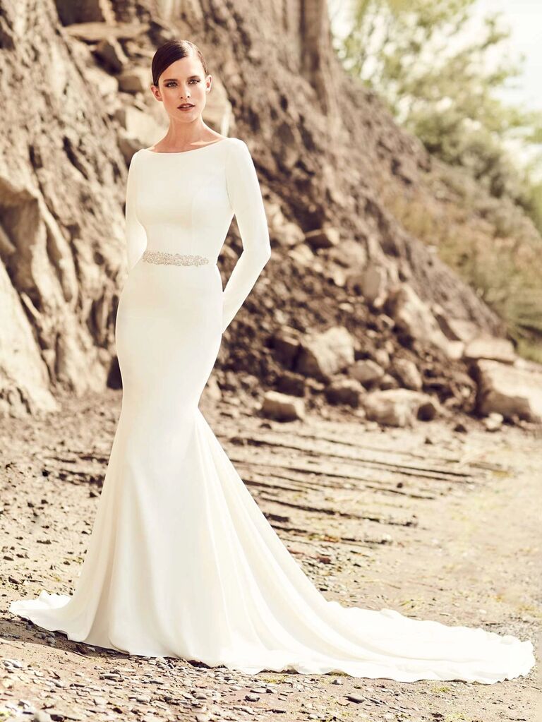 paloma blanca plain white high neck wedding dress with long sleeves jeweled belt deep v back and form fitting pleated flowy skirt