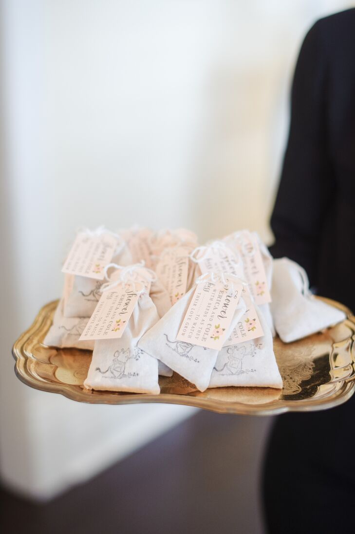 Each of Erica and Cole’s 119 guests was given seed packets with a small field mouse accent and personal tag as their wedding favor. “We felt there was special symbolism in having a continual reminder of our wedding day and watching something “grow” from it,” says Erica.