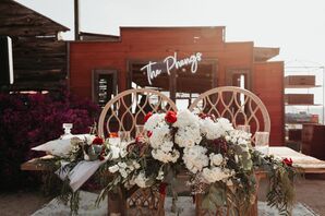 Bohemian Sweetheart Table with Chairs and Flower Arrangement