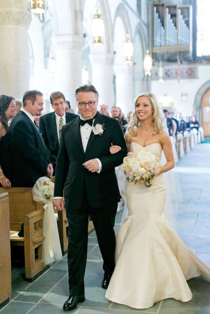 Laura wore a strapless blush Anne Barge fit-and-flare dress.