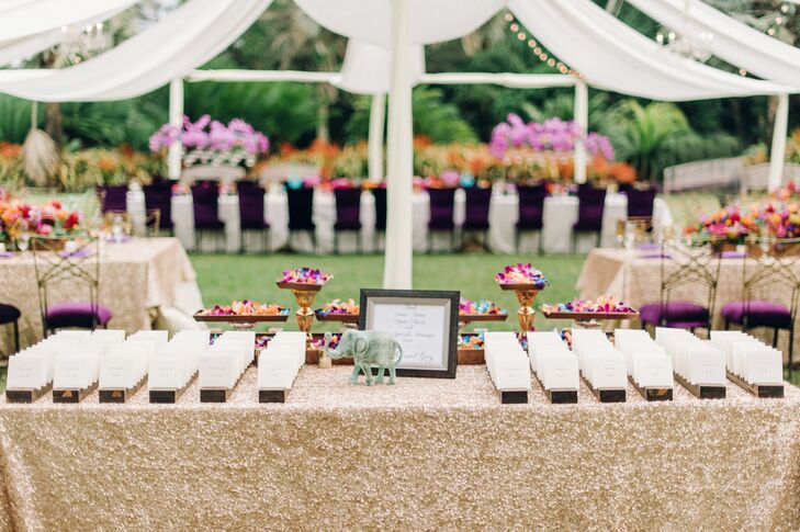 Glittery linens topped the escort card table, where guests found their table assignments on formal cards placed into rows.