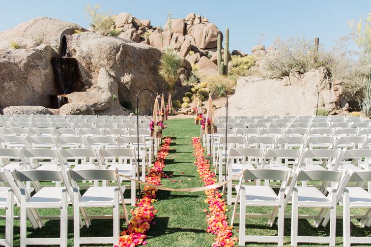 "I wanted our family and friends to soak in as much Arizona sunshine and desert as possible, so we took our chances and held our ceremony at Promise Rock at the Boulders Resort," Kelsey says. "We had 75-degree weather without a cloud in the sky. Perfection."