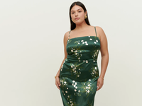 green slip fitted dress with floral pattern and spaghetti straps