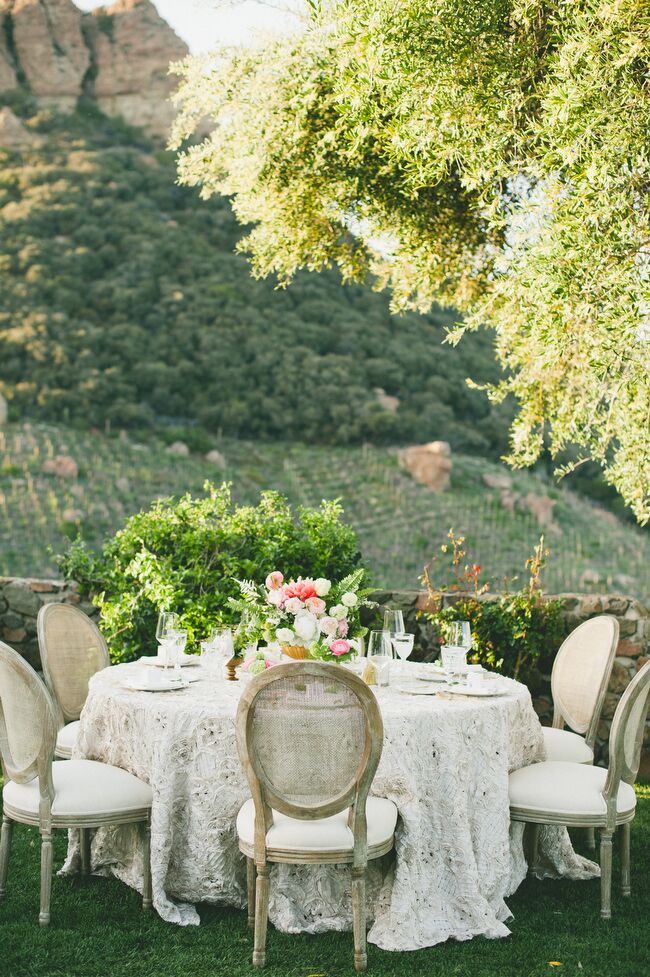 For the reception decor, Sarah and Brendon channeled Parisian elegance via French dining chairs, textured linens and “perfectly imperfect” arrangements of cream and pink seasonal blooms. On the tabletops, gilded cutlery and white china provided understated glamour.