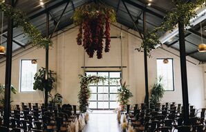 Pampas Grass Lined the Aisle and a Flower Installation Hung Overhead at Moody Wedding Ceremony