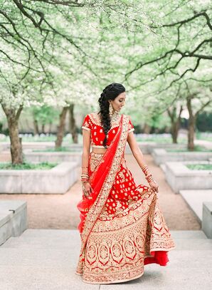 Bride with Traditional Red Lehenga, Fishtail Braid, Bracelets and Gold Earrings