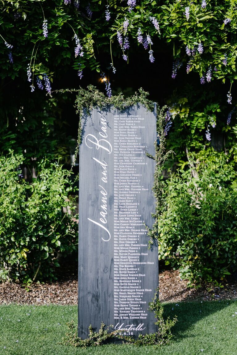 Wood seating chart with calligraphy