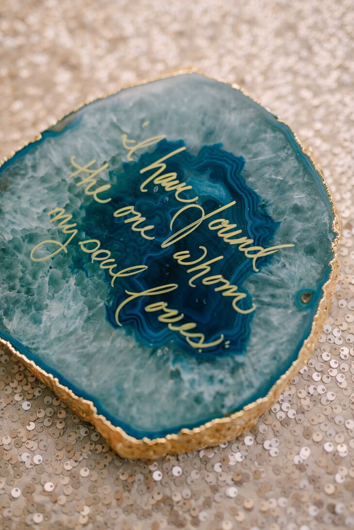 Agate decor took the natural theme one step further with gold borders and gold calligraphed quotes on the rich blue surface. This agate, beside Madelyn and Joseph's cake, read "I have found the one whom my soul loves."