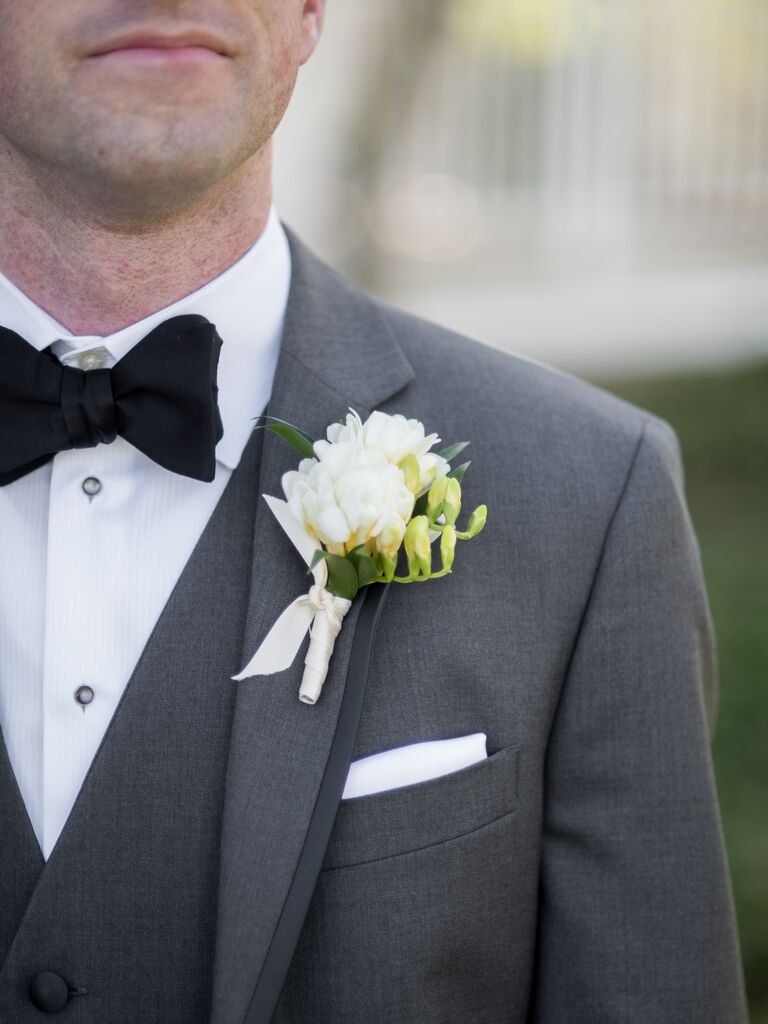 affordable wedding boutonniere with white freesias