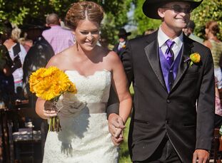 Mandi and Daniel's at-home wedding in Fallon, Nevada had a rustic, country flair with wooden accents, haystack displays and lacy linens. A yellow and 