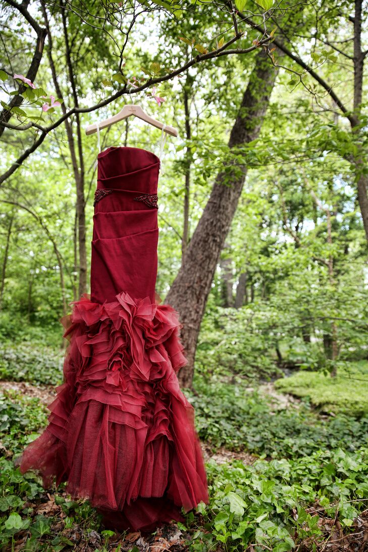 The bride wore a stunning red crimson strapless dress designed by Vera Wang on the wedding day.