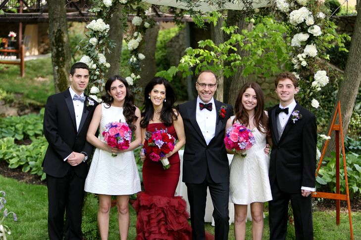 The bride and groom stood with their two daughters and two sons who made up their wedding party.