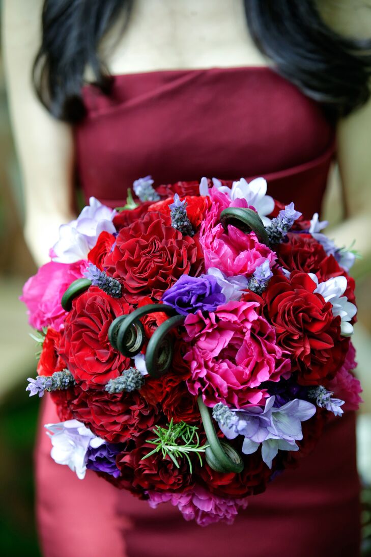 The bridal bouquet was a mix of peonies, garden roses, spray roses, ranunculus, freesia, lavender and fiddlehead ferns with a touch green, designed by TableArt.