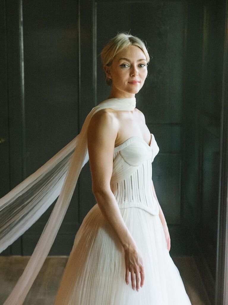 AnnaSophia Robb wears a beautiful white wedding dress. 