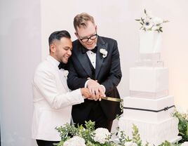 Couple cutting the cake at wedding