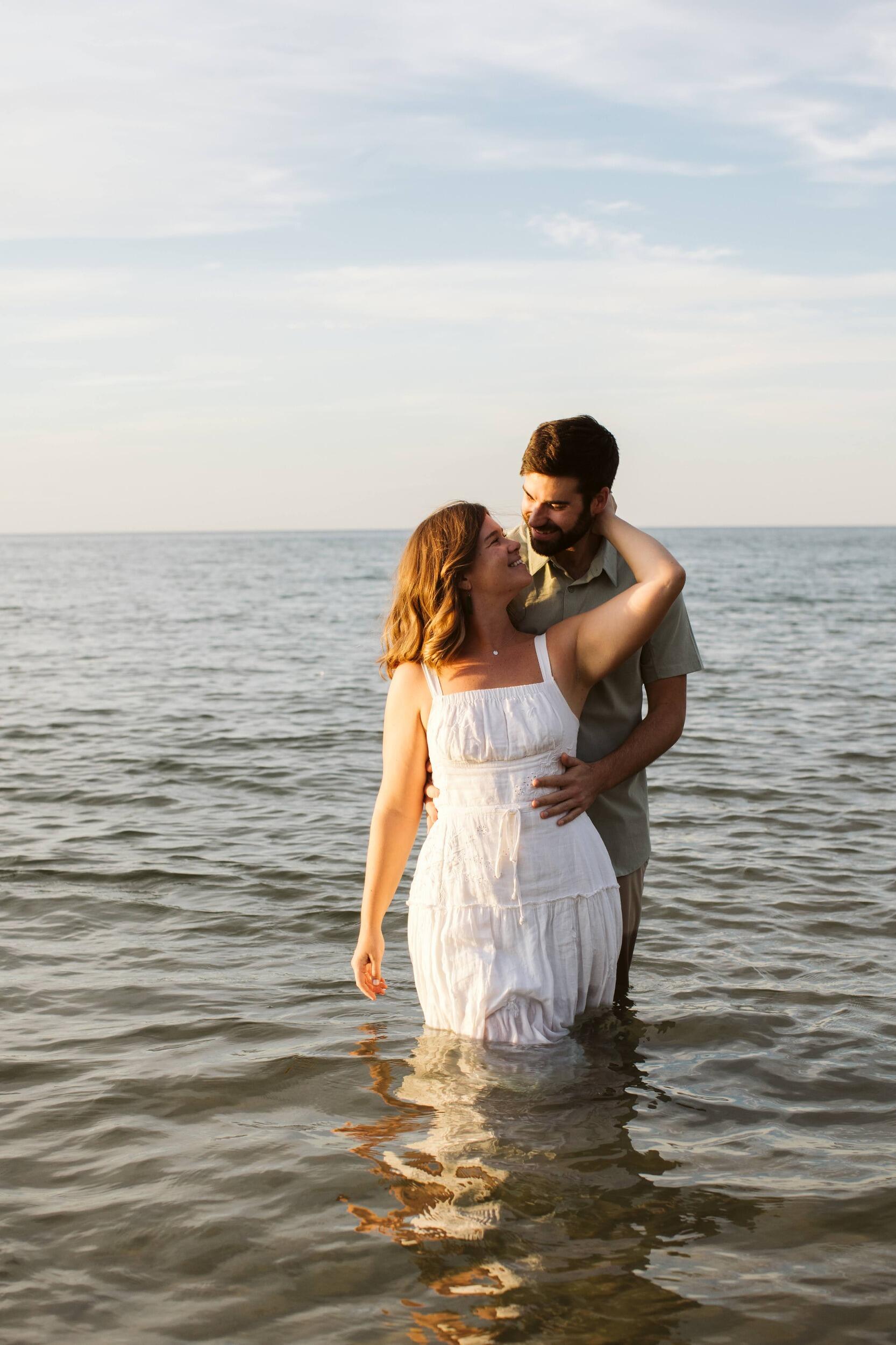 With Lake Michigan at the center of so many of their memories, they figured it was only fitting to take their engagement photos in the lake.