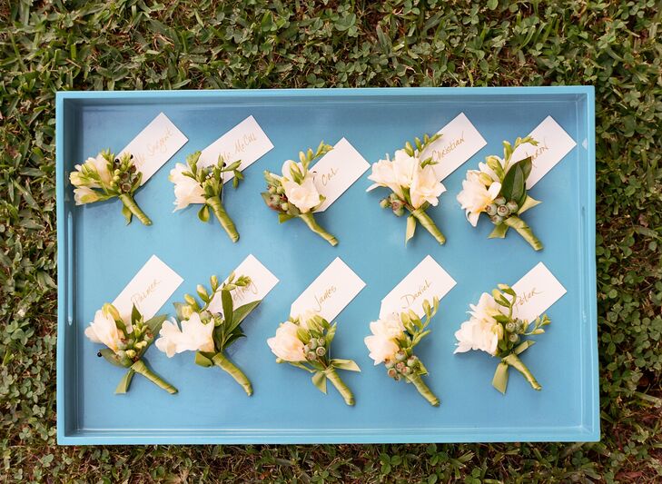 Cal and his groomsmen wore green and white boutonnieres made from blueberries and freesia.
