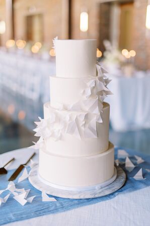 White Wedding Cake With Paper Airplane Decorations