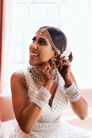 Bride Getting Ready and Putting on Jewelry