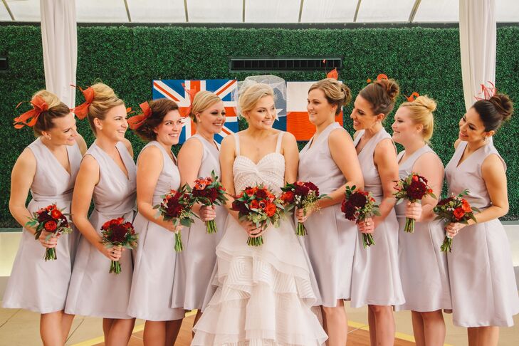 The bridesmaids wore sleek silver Alfred Sung dresses with red fascinators made by the bride’s grandmother.