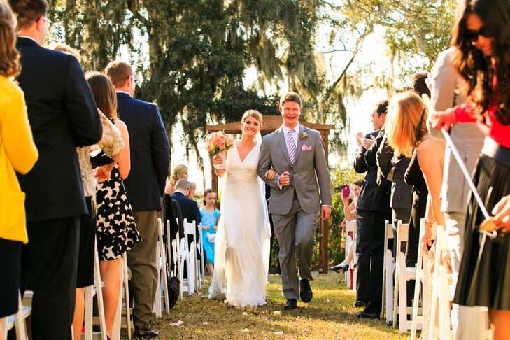Amanda wore a simple sheath wedding dress for her spring wedding. She loved the lace detailing on the sides and back and the deep V in the front. But what she really loved was being able to move in her dress. “I am not a very frilly or fancy girl, but fun was the key for my dress,” she says. “All I wanted to be able to do was dance with all our guests.”