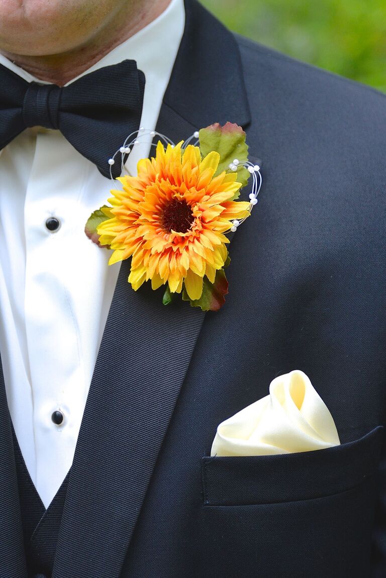 Faux sunflower bloom boutonniere on formal tux