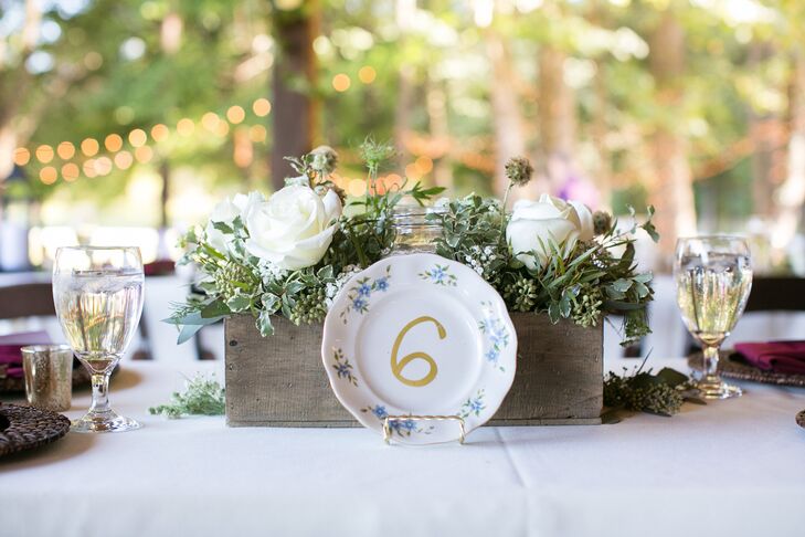 Victoria purchased mismatched china plates at local flea markets and painted them with table numbers.