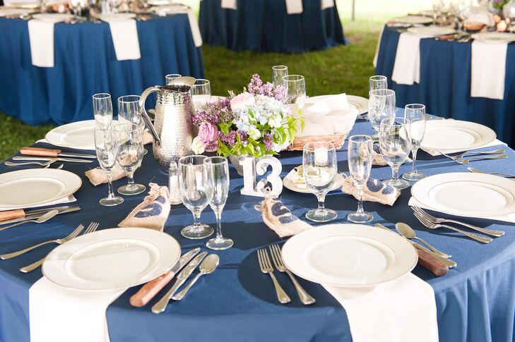 Each table had this lush arrangement of pink roses, lilacs, white and blue hydrangeas, purple roses and greenery in a silver vase. Tealight candles in clear glass votives surrounded the centerpieces for a soft glow.