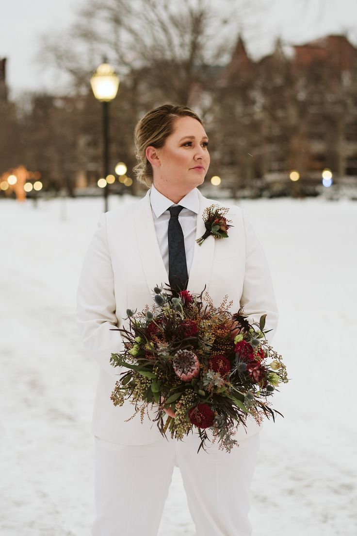 To-be-wed holding protea bouquet