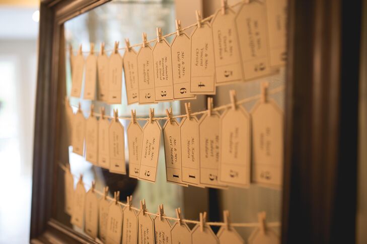 While living in Chicago, Illinois, Mandy created a lot of the wedding day's decor, including the escort cards that hung from strings of twine displayed on a wooden frame.