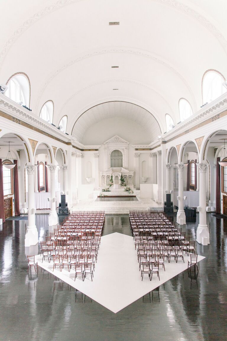 Ceremony in historic space with arches ceiling