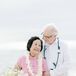 A Couple Renewing Their Vows in Casual Beach Ceremony on 50th Anniversary