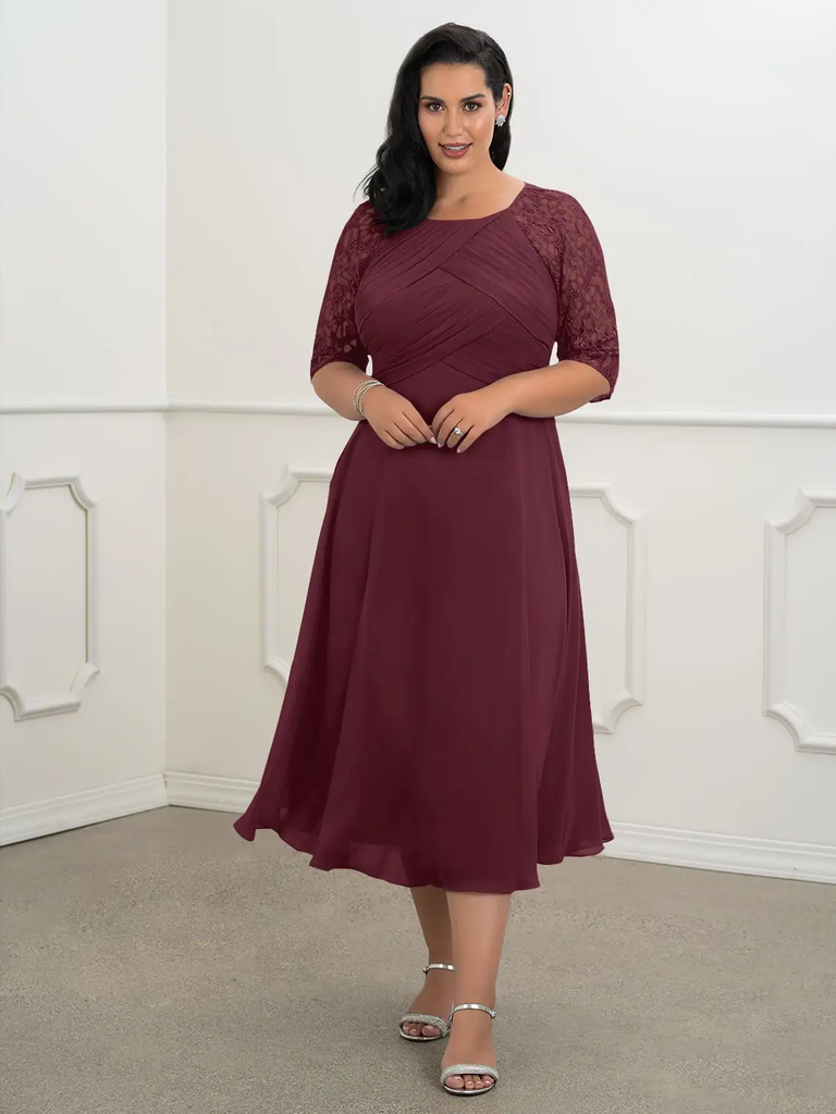 A model shows off this wine-colored gown with three-quarter sleeves and a mid-calf hem.