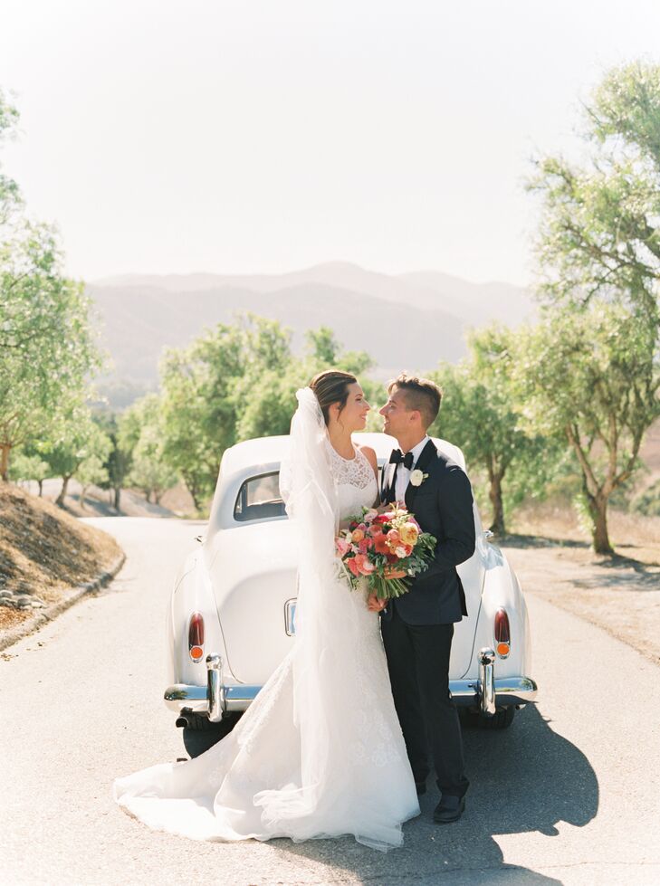 Bride and Groom with Vintage Car in Mountains