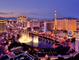 City skyline at night with Bellagio Hotel water fountains