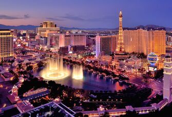 City skyline at night with Bellagio Hotel water fountains