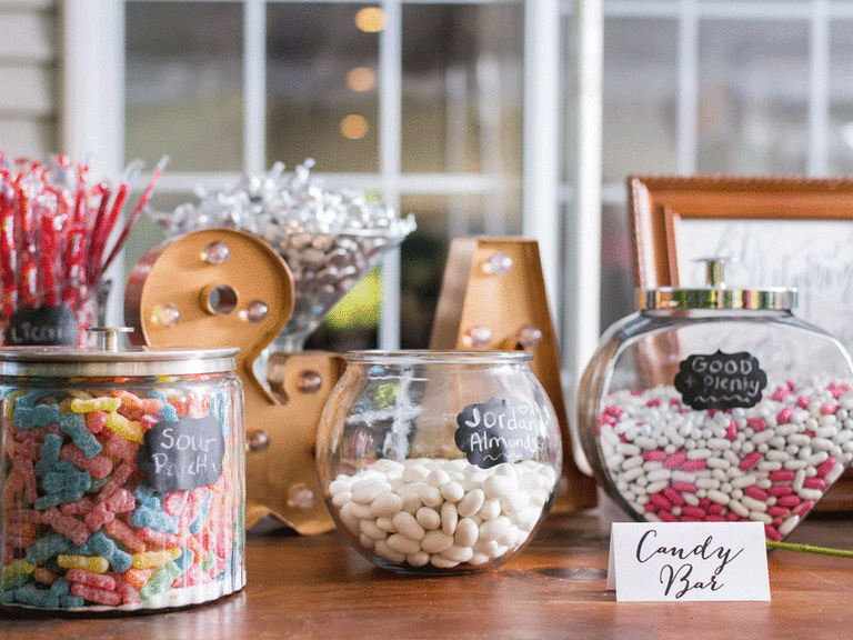 Colorful candy bar, that includes Jordan almonds, at a wedding reception.