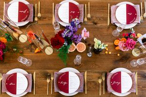 Place Settings on Farm Table With Purple Napkins