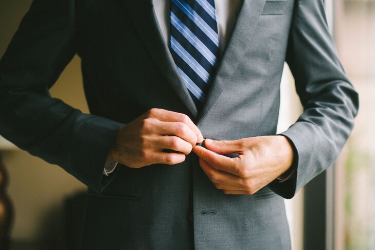 Jason wore a charcoal suit with a white shirt and a navy and light blue striped tie from The Black Tux.