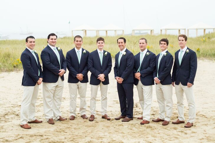 Inspired by the wedding's preppy, nautical feel, Brennan had his groomsmen don khaki trousers, white button-down shirts, sage colored ties and brown dress shoes.