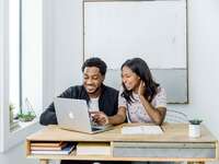 Engaged couple learning how to make wedding registry
