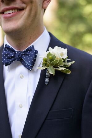 Groom with a Polka Dot Tie and White Boutonniere