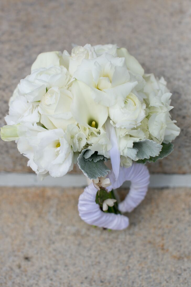 Rather than using flowers throughout the reception, the bride chose only to utilize the calla lilies in her bouquet -- leaving a larger portion of her budget to go toward the band and food.