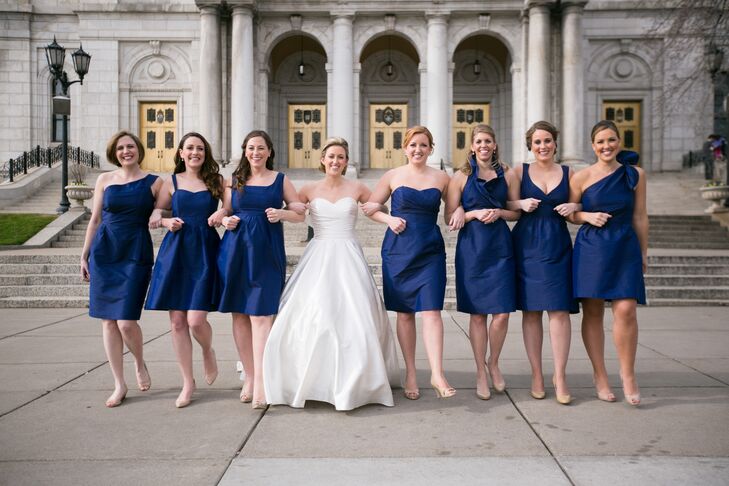 Each of Taylor's bridesmaids wore different variations on classic, navy LulaKate knee-length dresses.