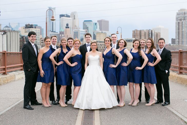 The bride's satin ivory gown popped against the navy LulaKate dresses she chose for her bridesmaids.