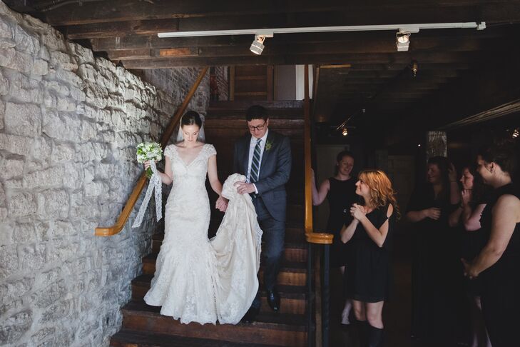 Kira wore a modified a-line lace wedding dress with a v-neck and cap sleeves. 
